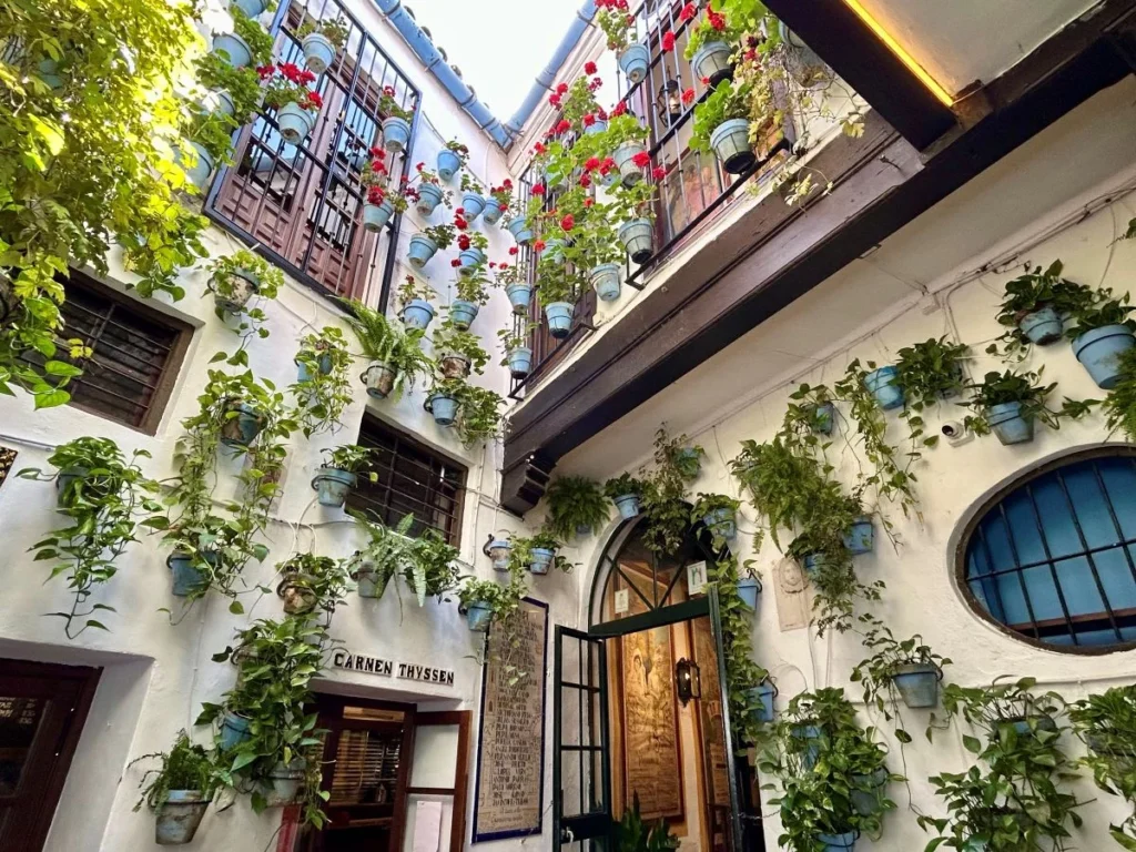 Narrow cobblestone backstreet and corners in Malaga old town hidden from tourists explored on a free guided walking tour