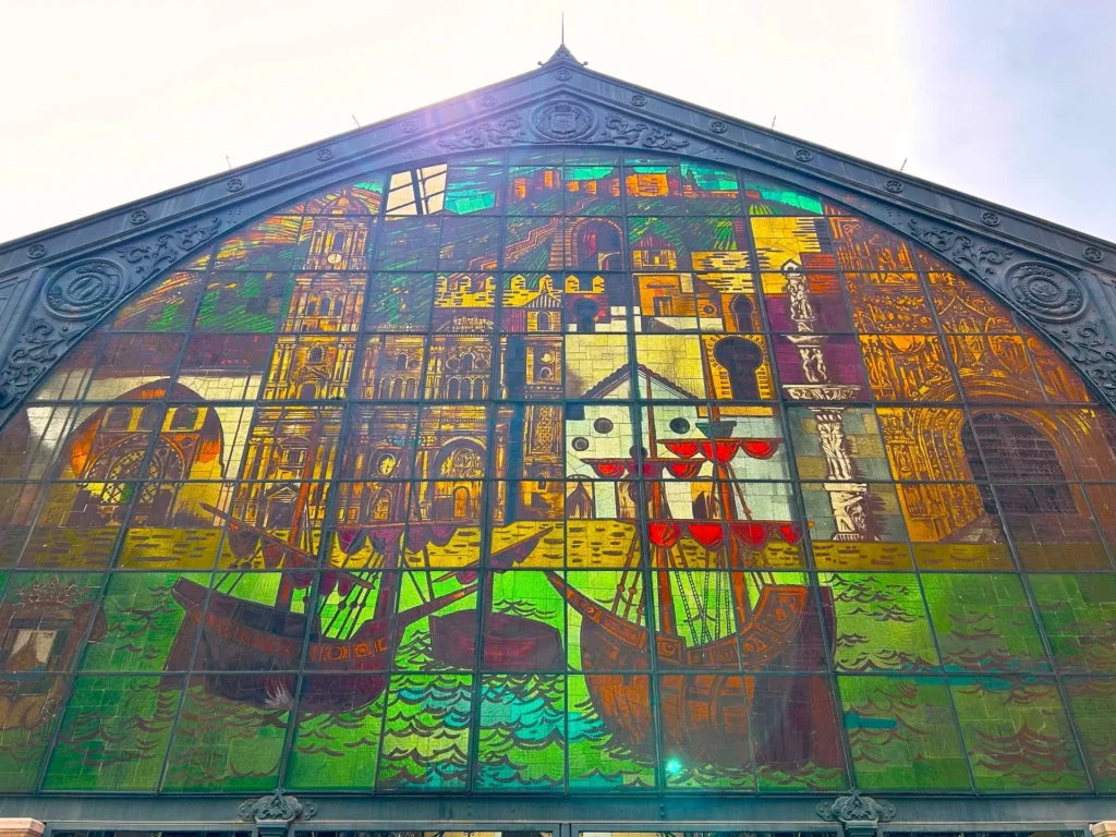Stunning stained glass facade of Mercado Central de Atarazanas in Málaga depicting the city's history