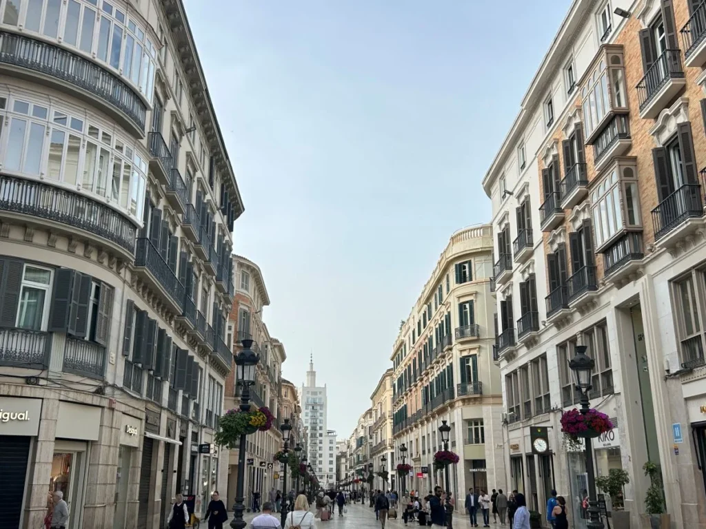 Calle Larios pedestrian street in Málaga with flower-decorated lampposts in autumn