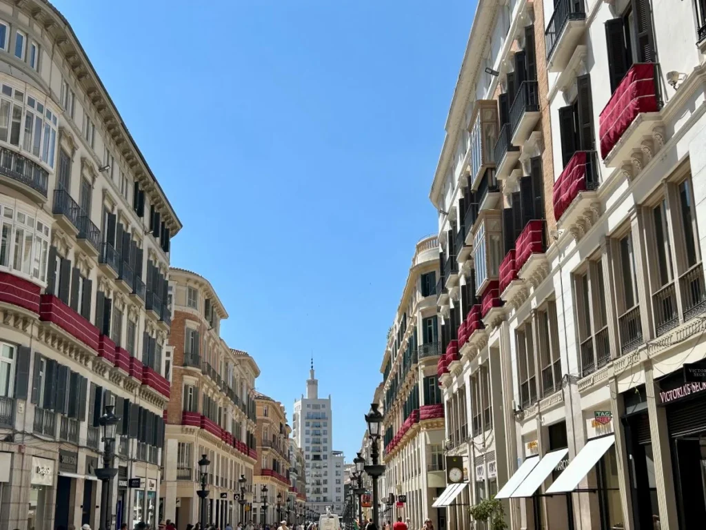 Elegant neoclassical pedestrian street Calle Larios for shopping lovers in the heart of Málaga old town with blue sky
