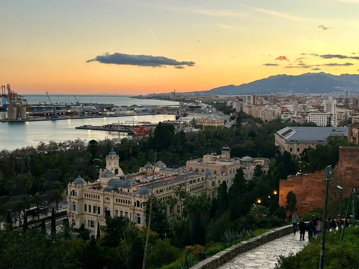 panoramic view over the sea and city centre of malaga from the alcazaba during sunset after dinner