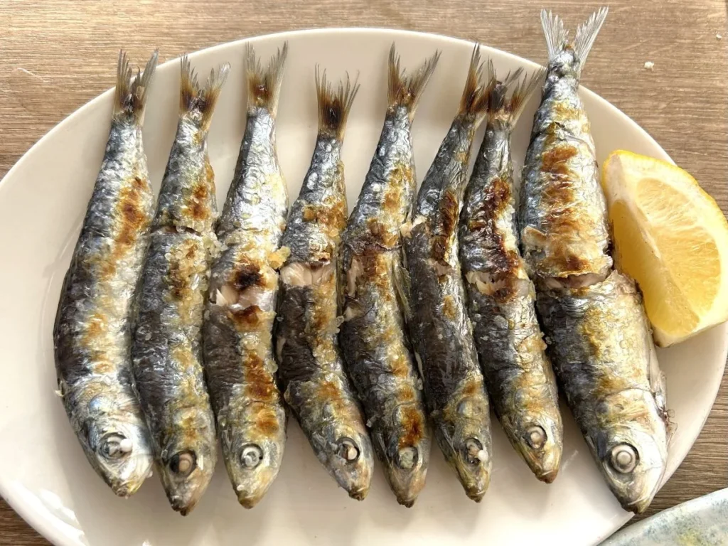 espetos sardine skewers grilled on the beach in Málaga andalusian typical spanish food