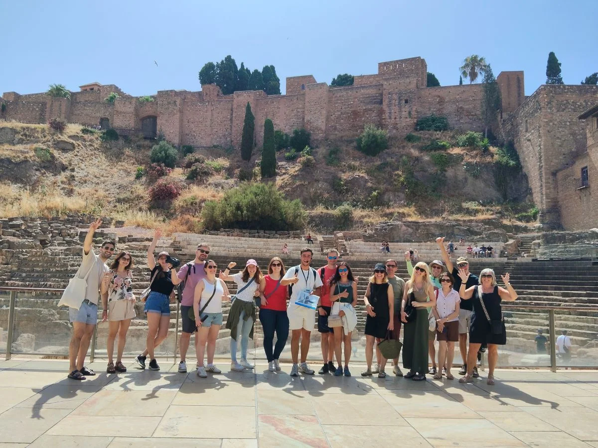free tour group with guide in front of the roman theatre and alcazaba during 3 day trip in malaga
