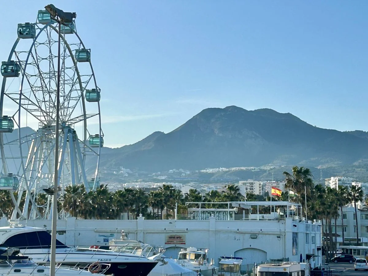 Puerto Marina Benalmádena Ferris wheel with La Concha mountain in the background, near Málaga